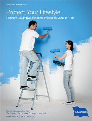 happy couple painting a room