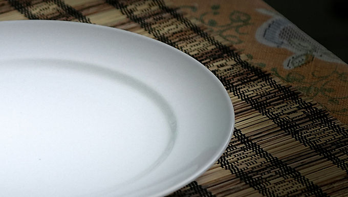 Julie fussed over eggs and pancake batter in the mixing bowls.