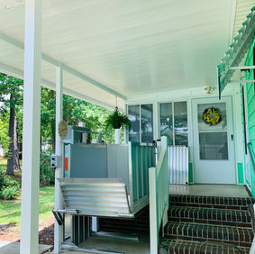Residential outdoor Vertical Platform Lift installed in Garden City, SC for safe accessibility.