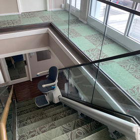 Commercial stair lift installation on indoor staircase in Charleston SC