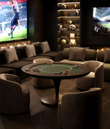Close-up of a poker table with chairs in a modern entertainment room, featuring large screens and elegant decor.