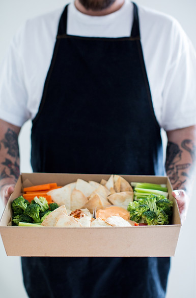 Hobart catering: chef holding a fresh individual lunch box