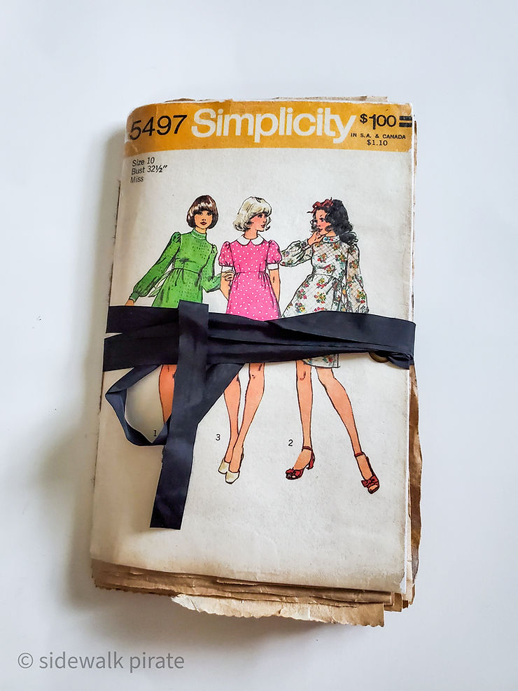 Simplicity pattern envelope used as a journal cover for a handmade, recycled journal tied closed with typewriter tape