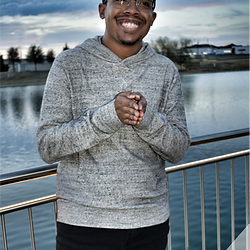 High school senior in a grey shirt and