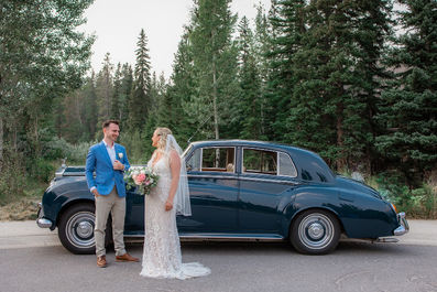 bride and groom in Canmore with Rolls Royce