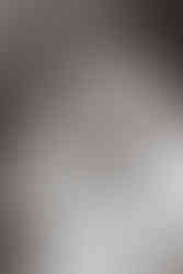 closeup of baby girl face during newborn session (black and white photo)