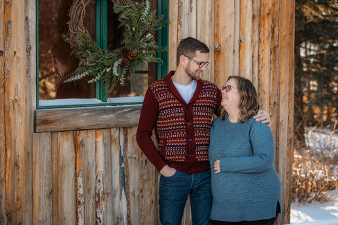 woman holds stomach for pregnancy photos