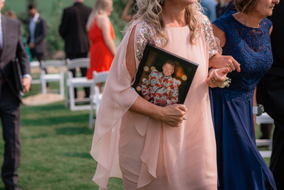 brides mom holds photo of her father