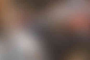 Pregnancy announcement - son sitting with chalkboard sign announcing big brother