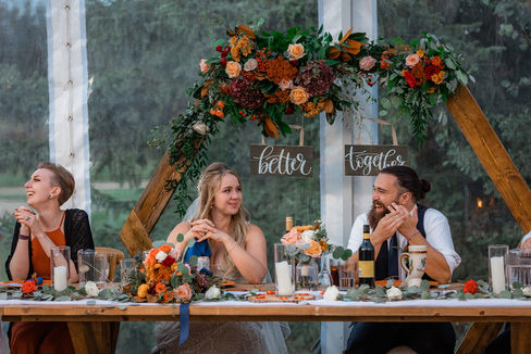 bride and groom at head table at Pine and Pond