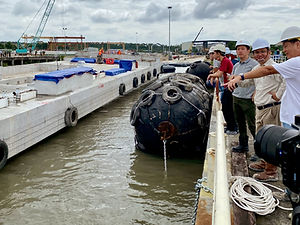 FloatVista engineers conduct final inspection of a floating concrete pontoon before deployment, demonstrating marine infrastructure expertise.