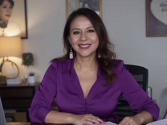 Dr. Karina Gil smiling in an office