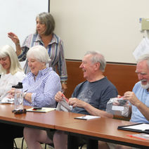 Smiling group of participants in AIL classroom
