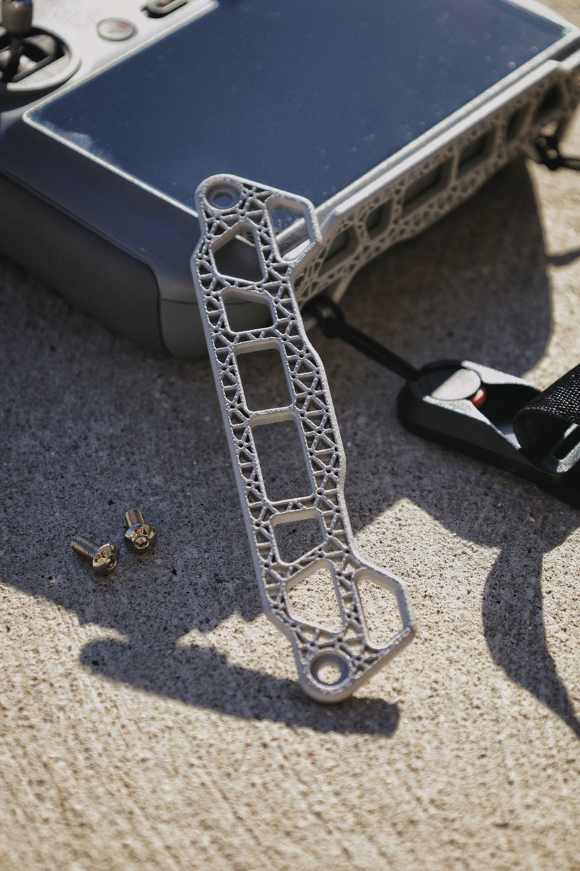 Lattice DJI RC 2 lanyard mount with mounting screws.
