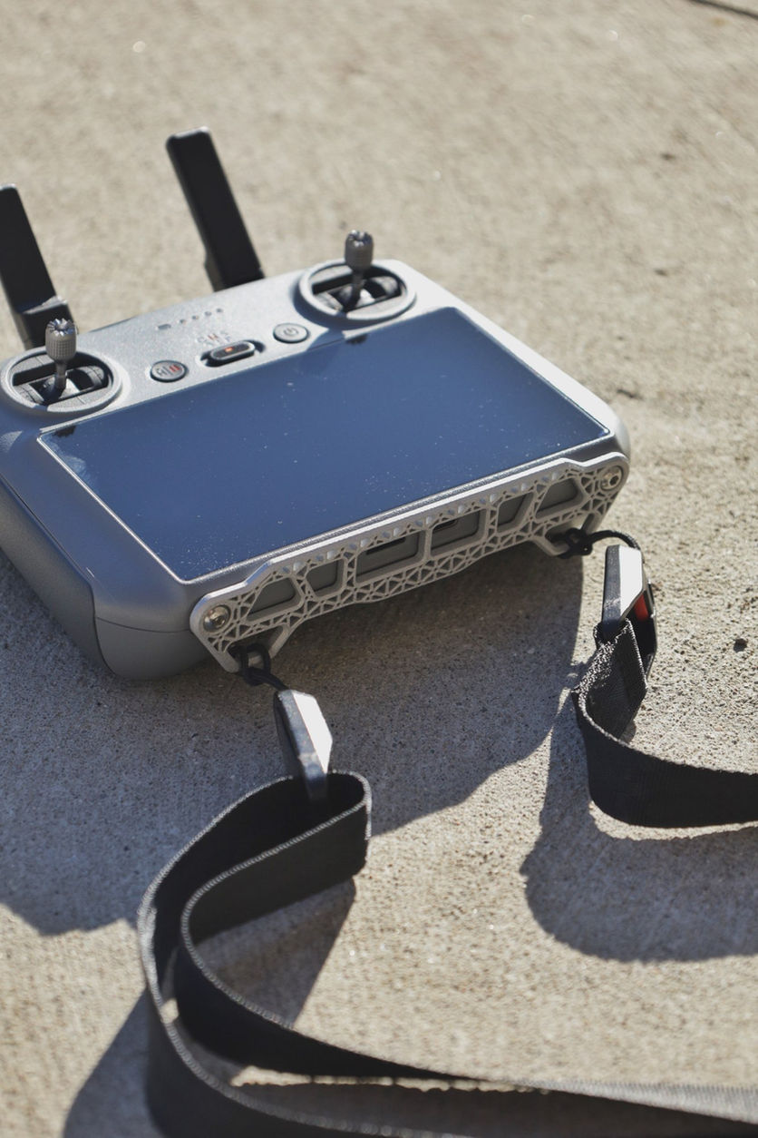 DJI RC 2 lanyard mount attached to a controller