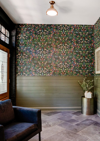 Modern Foyer Design with green vertical shiplap and black bold floral wallpaper