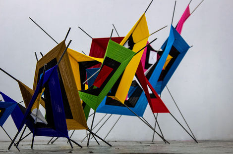 Layered mixed-media sculpture in vibrant tones reflecting cultural memory and resilience – Threads of Resurrection series