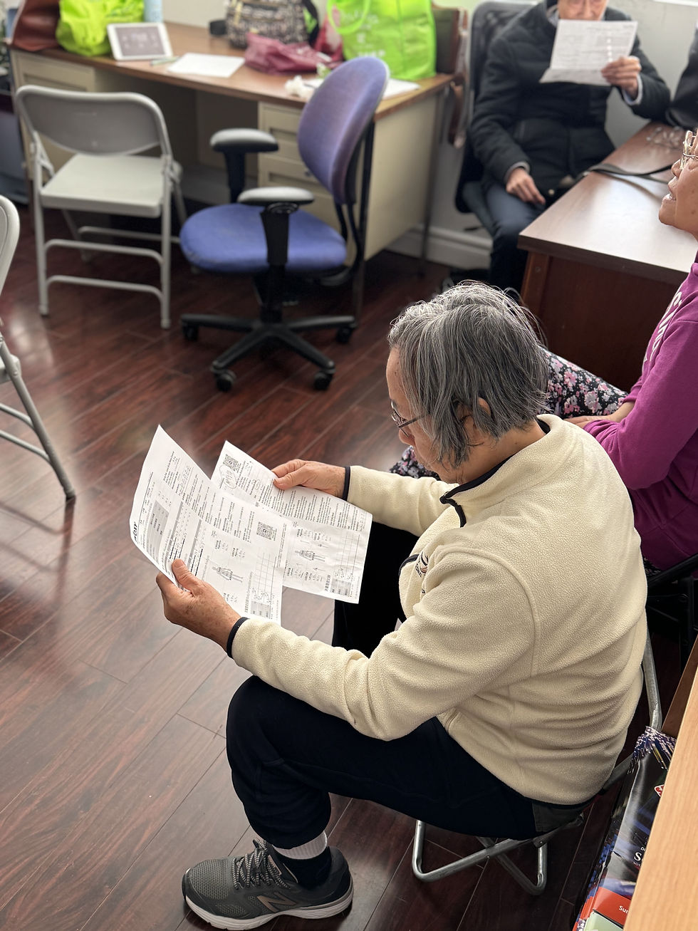 A senior participant at WOXY’s South Unionville event reviews her body composition report after the diabetes health session.
