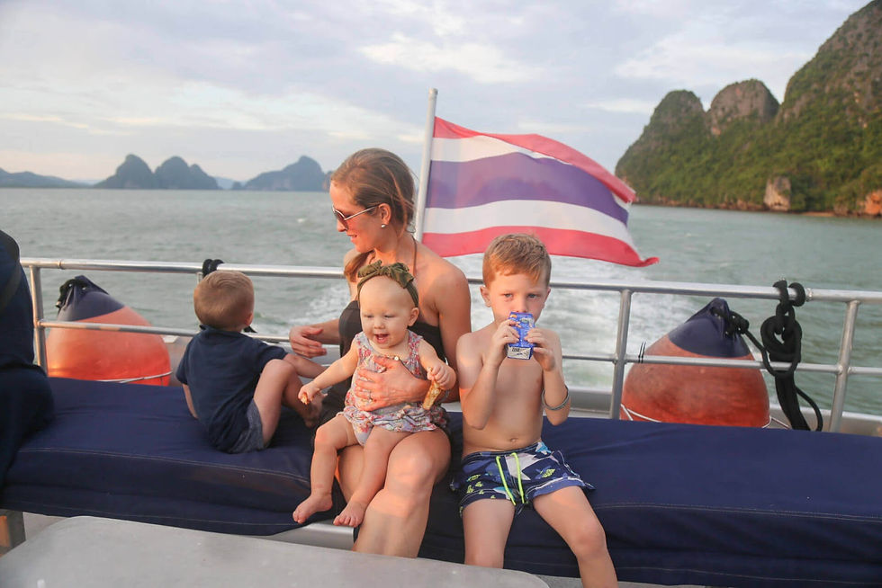 Family island hopping boat trip in Thailand with calm sea and kids onboard