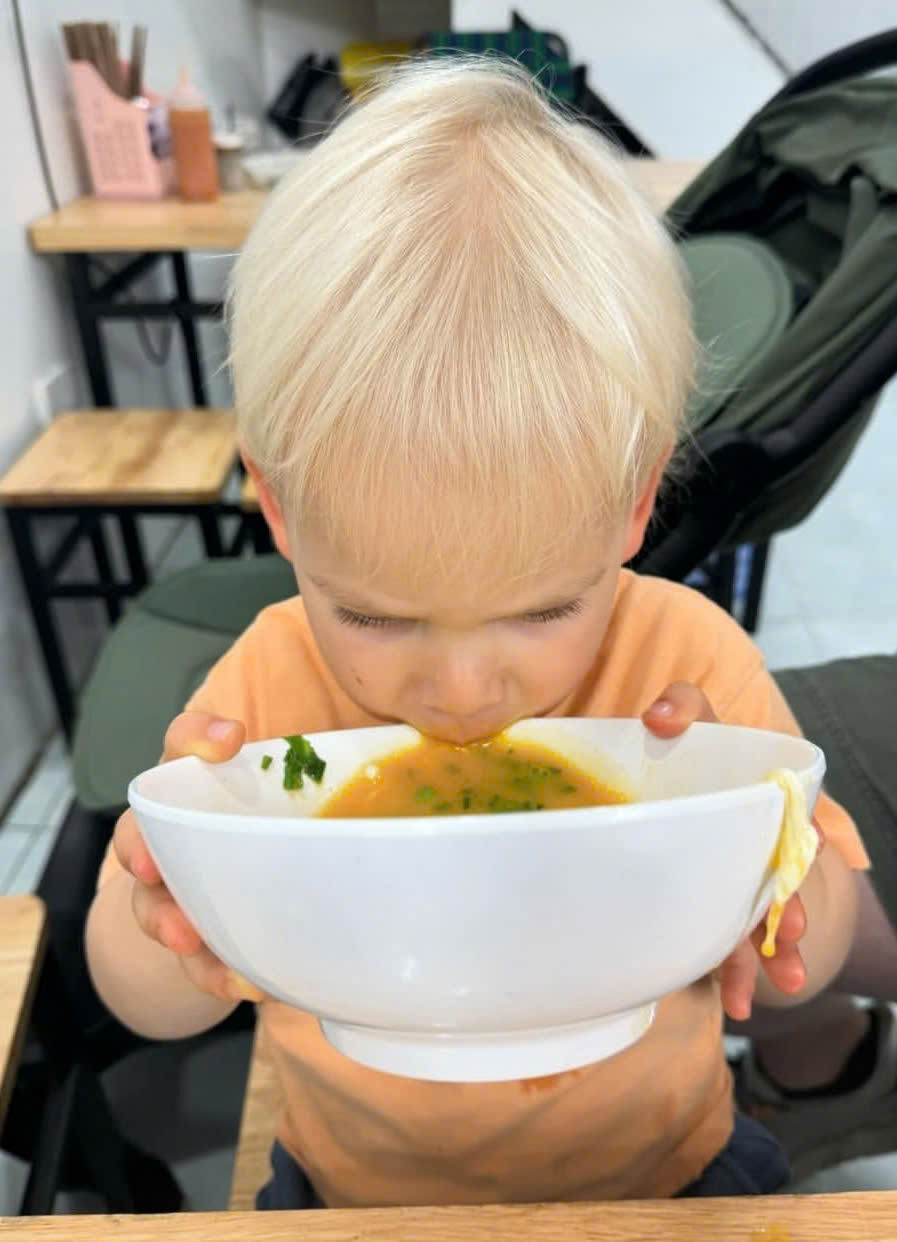 Child enjoying a meal at a family-friendly restaurant in Ho Chi Minh City