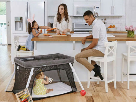 Happy family traveling in Vietnam with baby and toddler, relaxing at luxury Airbnb villa with KidEase Rentals baby gear including stroller, crib, and car seat.