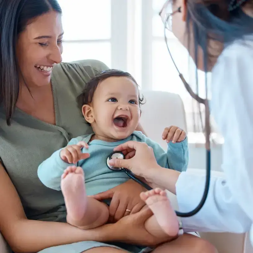 Parents with toddler visiting English-speaking pediatrician clinic in Vietnam