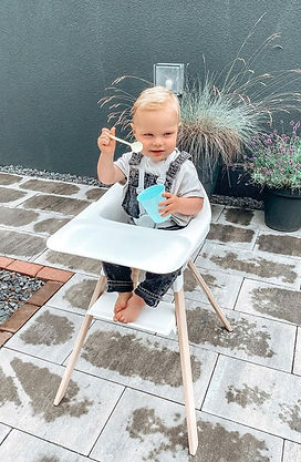 Stokke Clikk high chair on a villa balcony in Nha Trang with baby during breakfast overlooking the sea