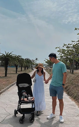 family-walking-my-khe-beach-danang-with-