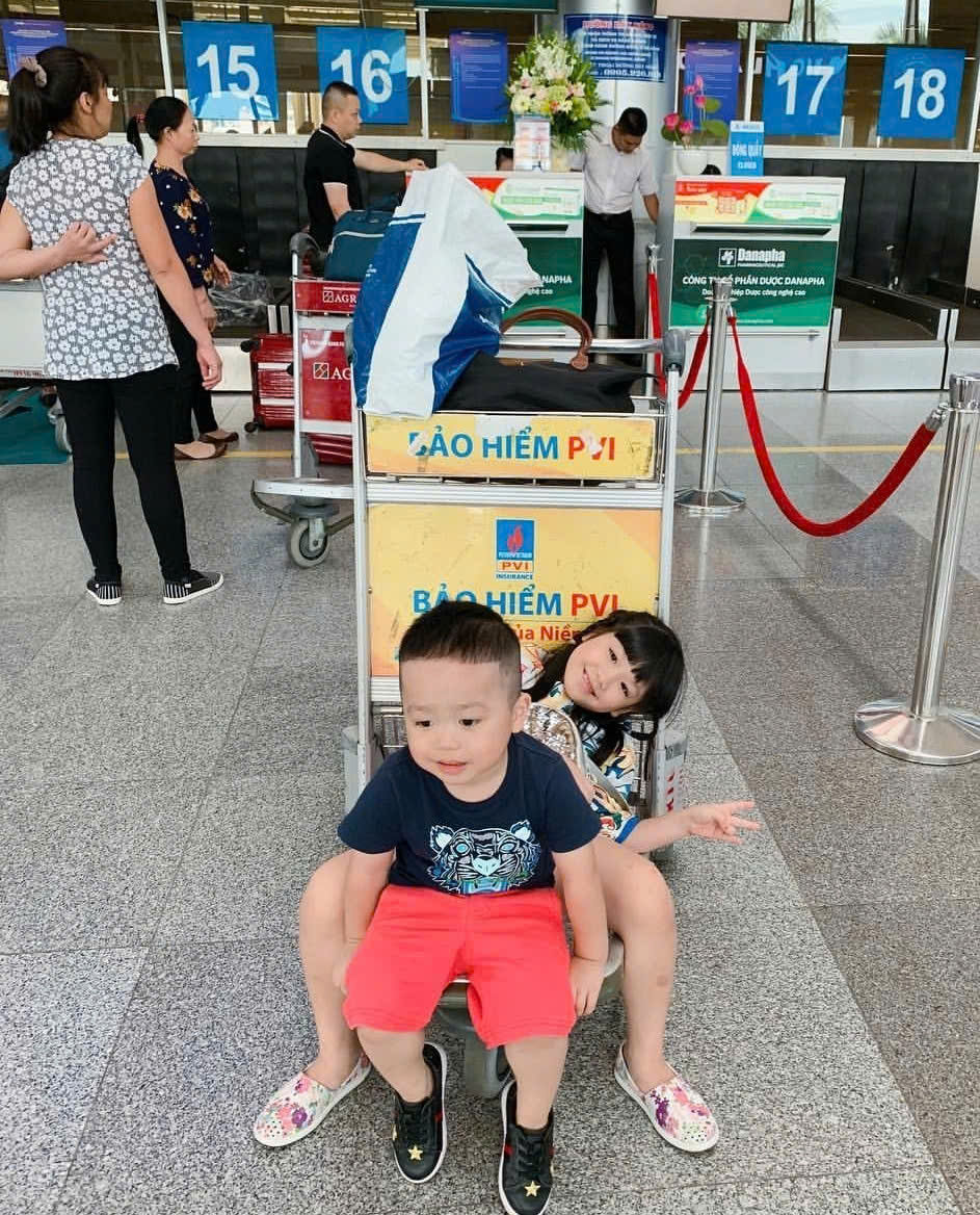 Family arriving at Da Nang International Airport with baby preparing for hotel transfer