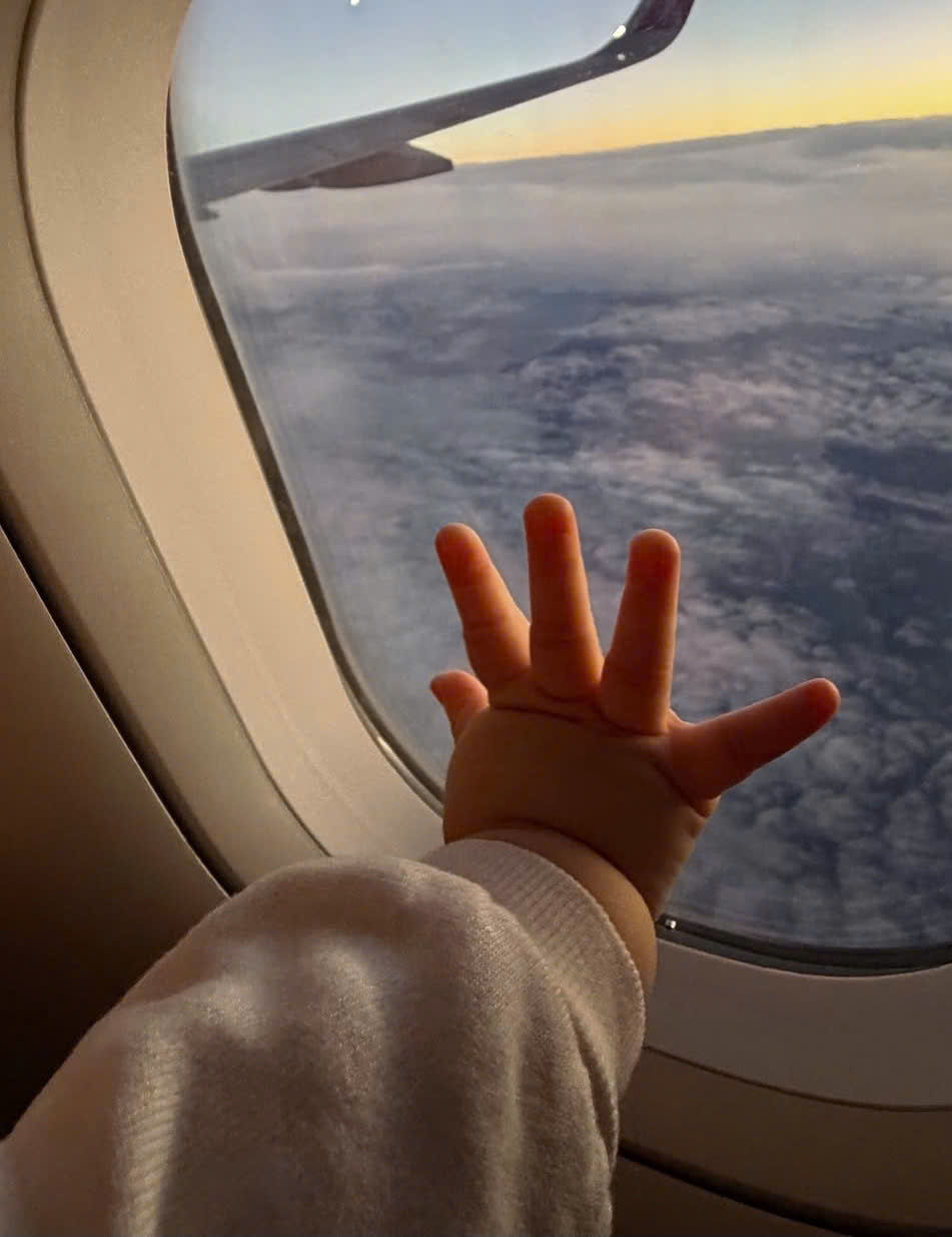 Airline bassinet seat used by a baby on a long-haul flight to Vietnam