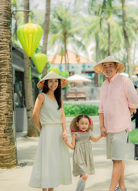 Family with baby enjoying a private villa pool in Hoi An Vietnam during a family trip