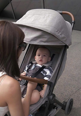 Nuna TRVL stroller used by family walking near An Bang Beach in Hoi An Vietnam