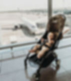 Family arriving in Vietnam airport with baby stroller and luggage for a safe and smooth family trip
