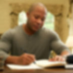 ramsey zinjin writing at desk