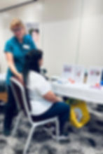Marion providing Reiki at an event