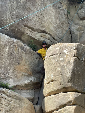 Scouts Climbing Through Cliffs