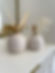 A pair of clay vases and natural wreaths