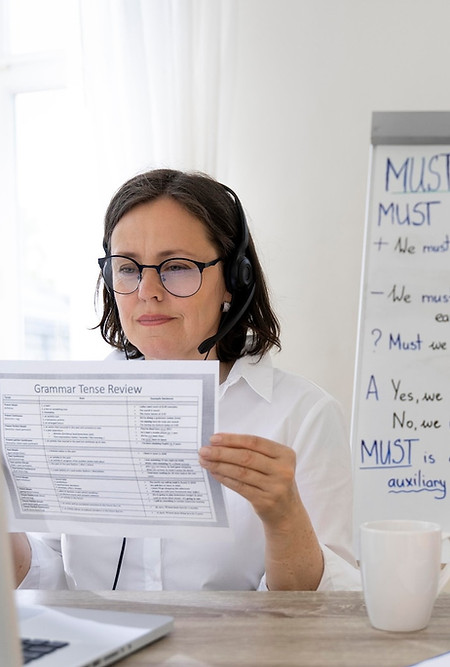 teacher-doing-her-english-class-with-whiteboard_23-2148999494.jpg