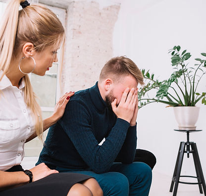 beautiful-female-psychologist-consoling-her-male-depressed-patient-clinic.jpg