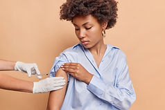 indoor-shot-afro-american-woman-gets-vaccination-arm-imuunity-health-prevents-being-infect