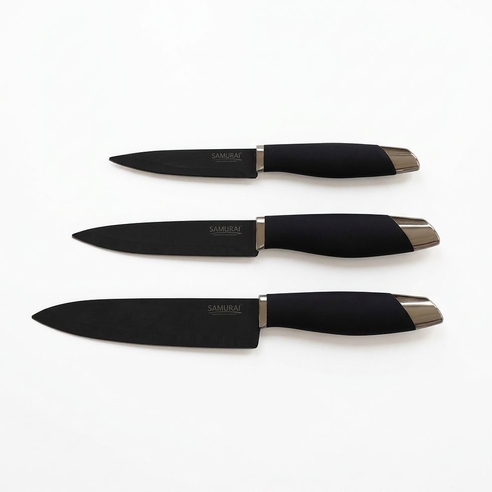Packshot photography of three black kitchen knives with black handles, neatly arranged against a white background.