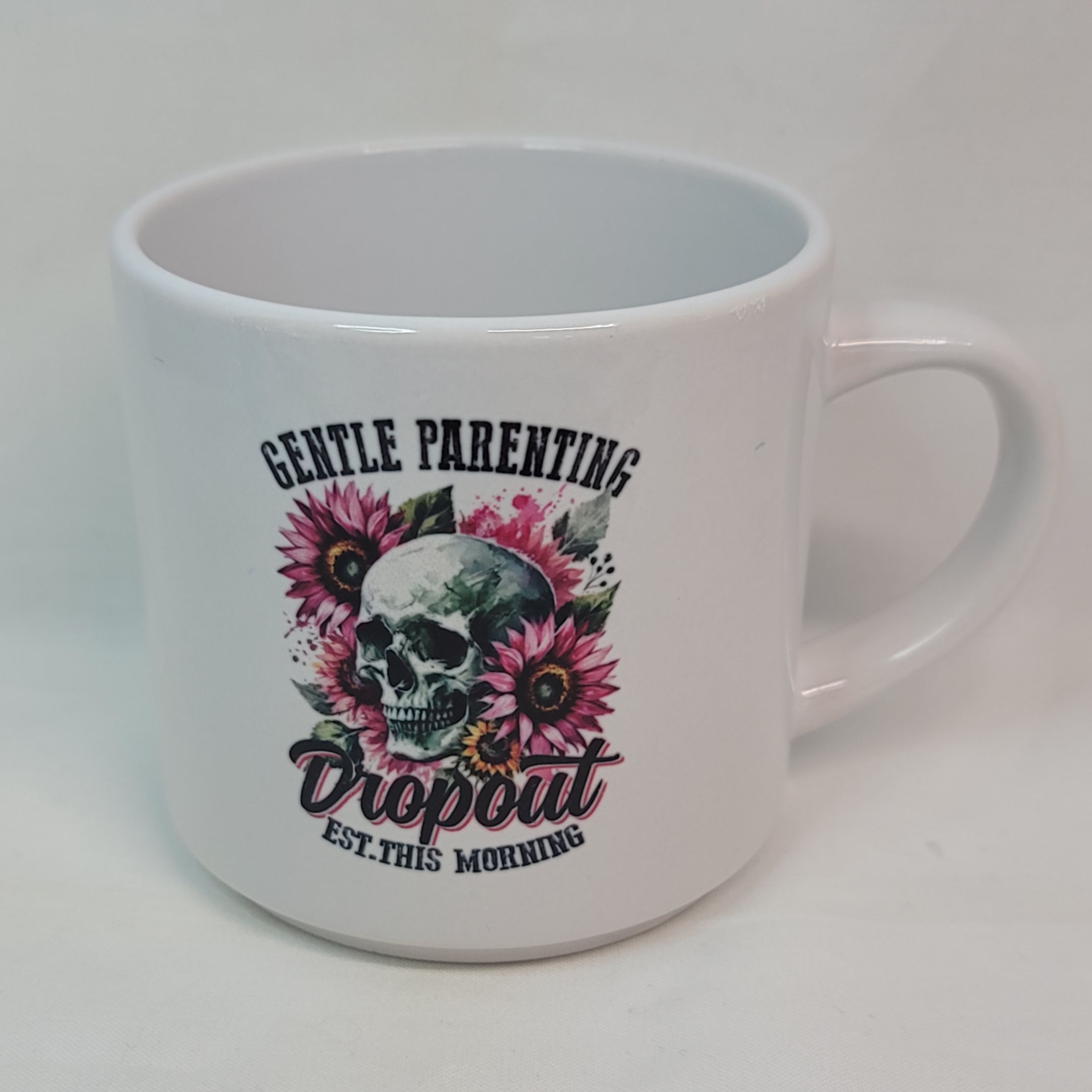 White mug: Gentle parenting dropout, skull with sunflowers