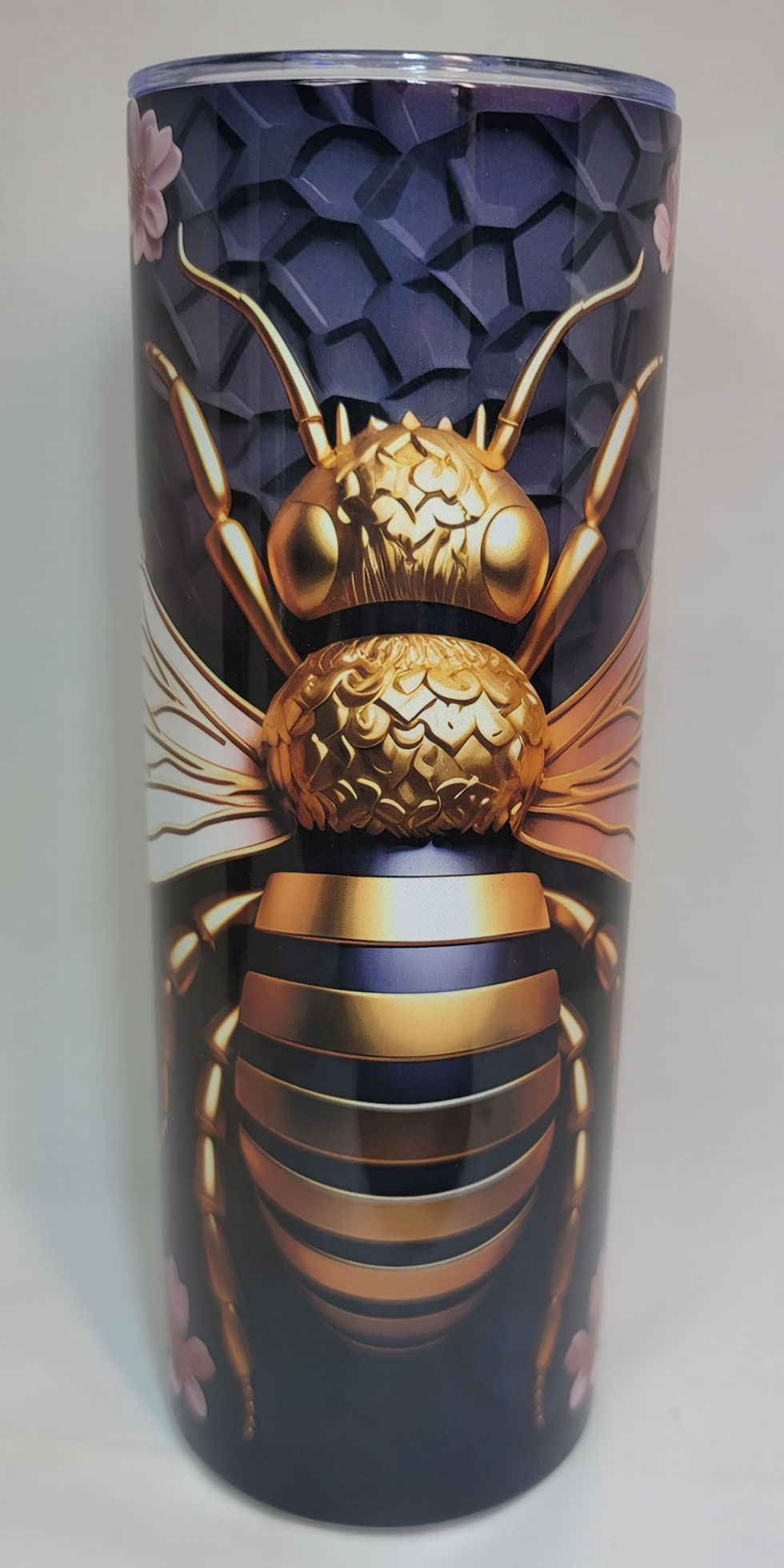 Thumbnail: Golden bee amidst pink blossoms