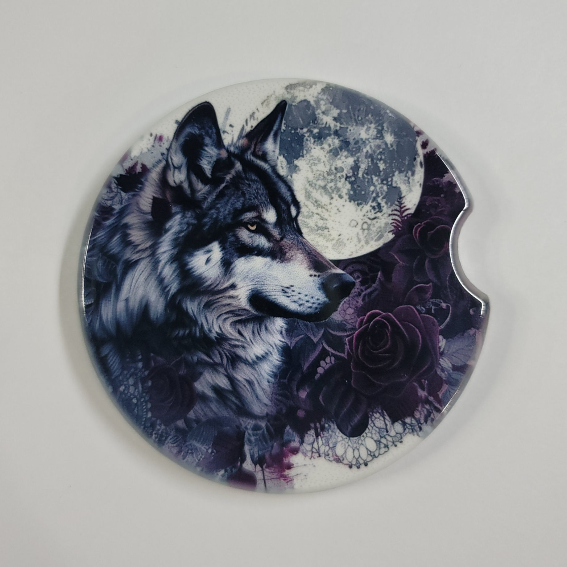 Wolf howls at moon; car coaster