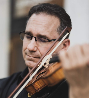 Gabriel Gordon, violinist with Chamber Orchestra Ogden, professional photograph. Plays violin with feeling.