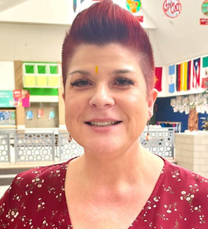 Julie Neilson, violinist with Chamber Orchestra Ogden, professional photograph. Elementary classroom background.