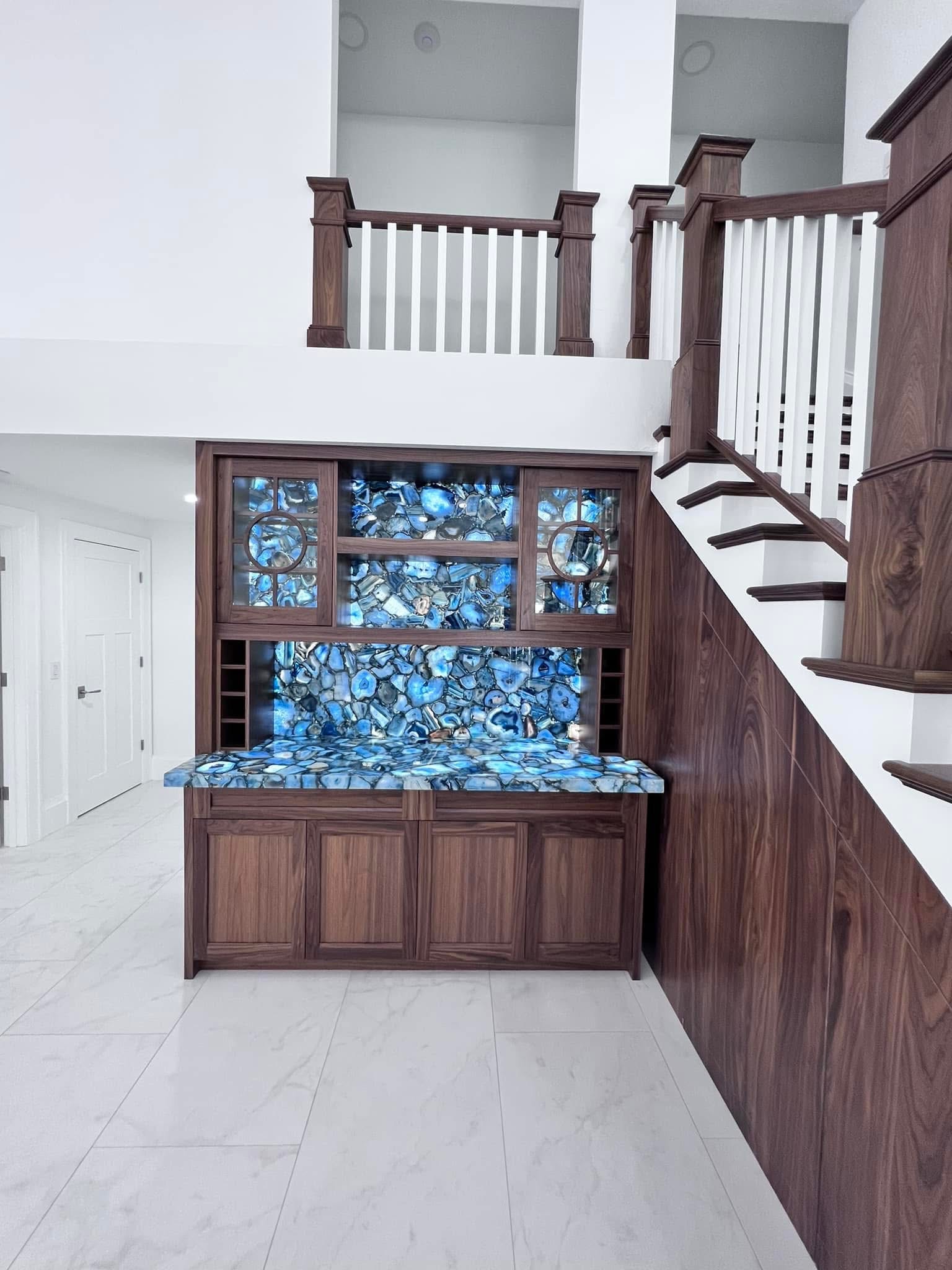 Staircase and wet bar, Naples area home by Coastal Custom Homes SWFL