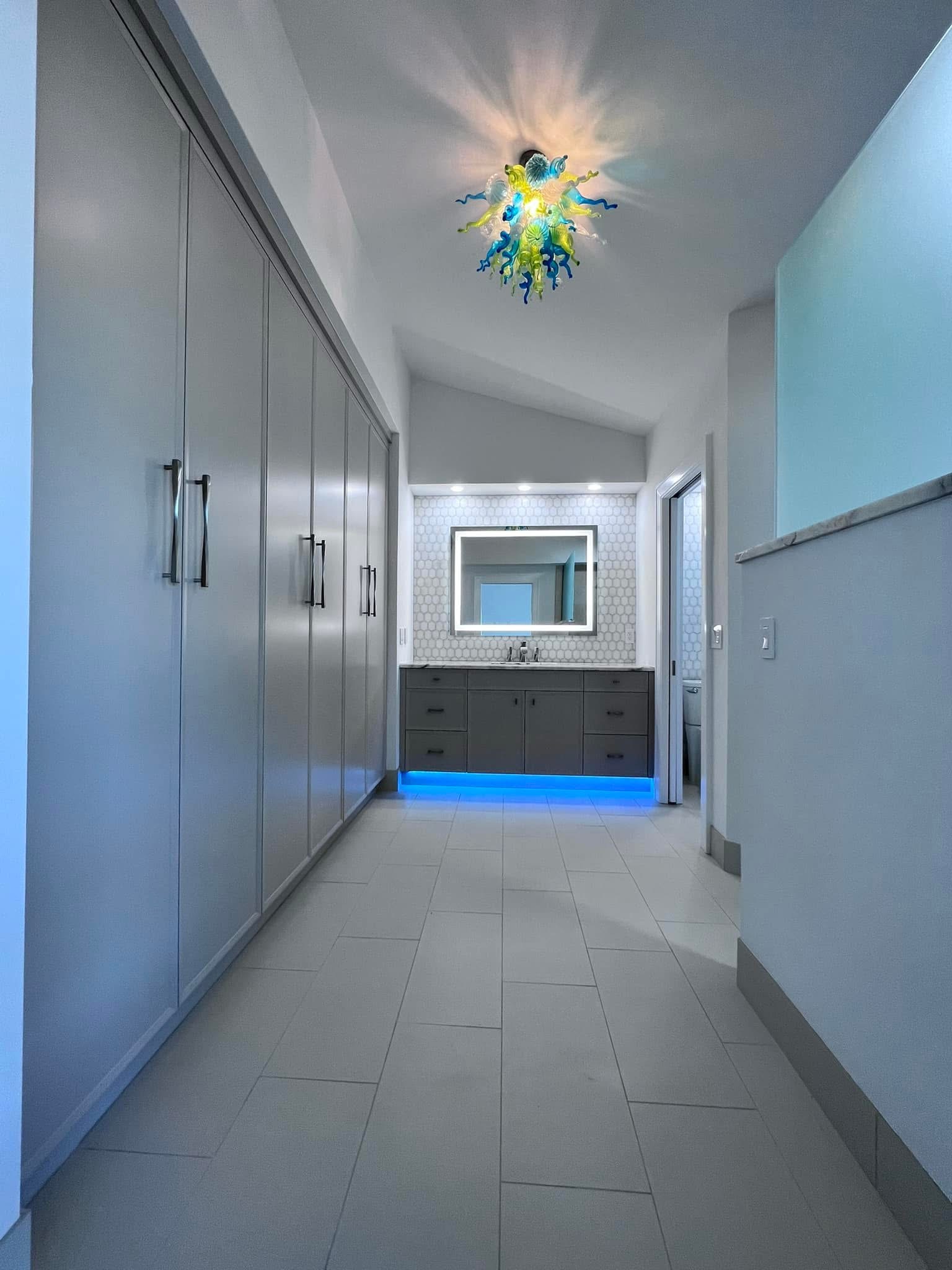 Hallway with lighting, Naples area home by Coastal Custom Homes SWFL