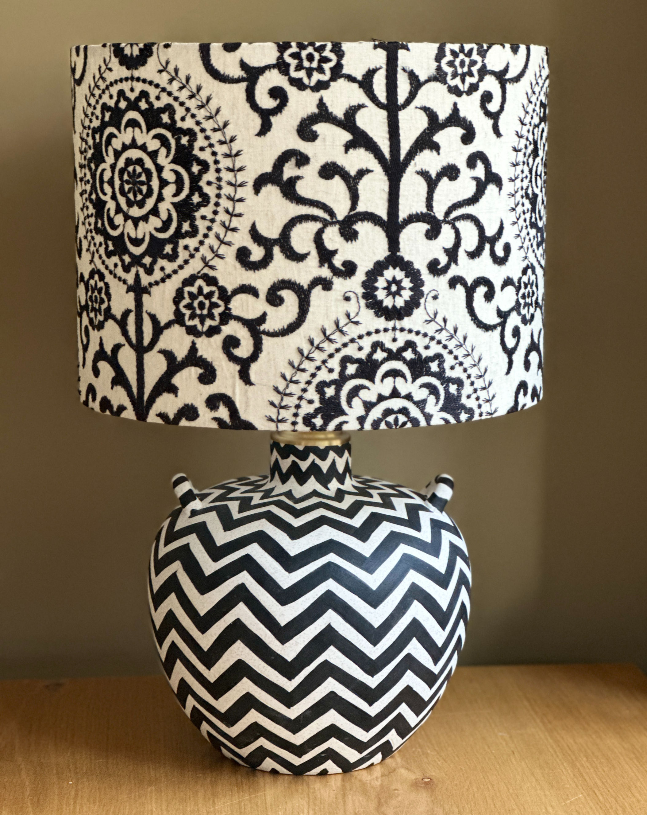 Black and white ceramic lamp with chevron pattern and embroidered floral damask lampshade in black and cream