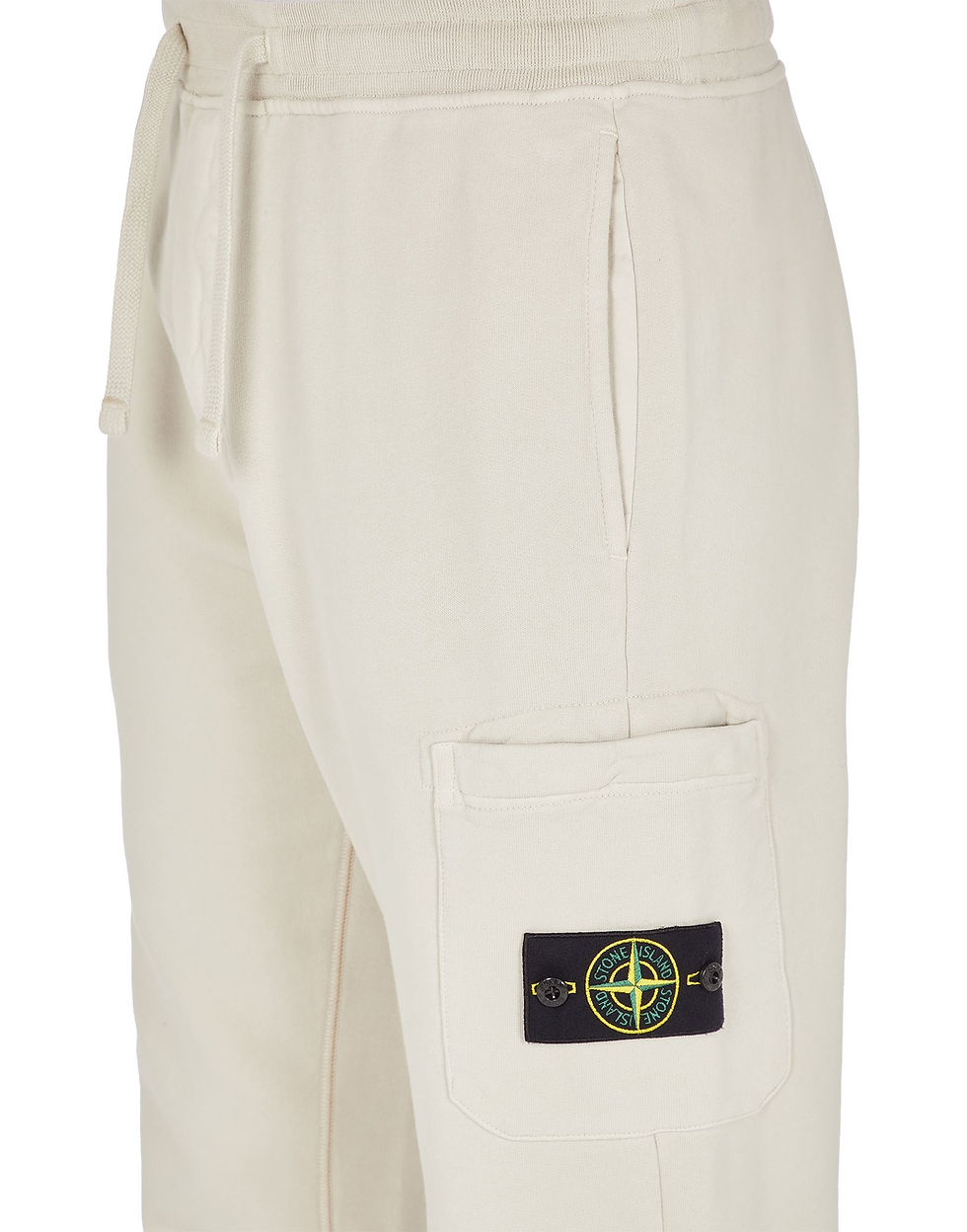 Miniature : Pantalon Stone Island crème clair avec le badge de la marque sur la poche.
